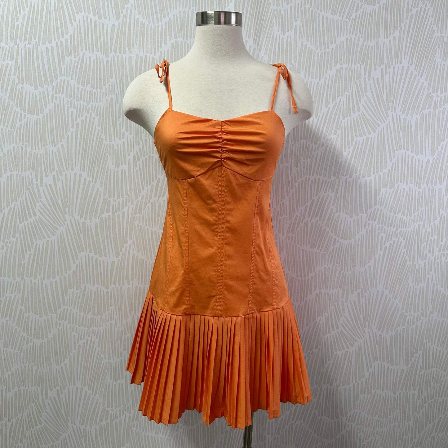 Orange pleated skirt dress